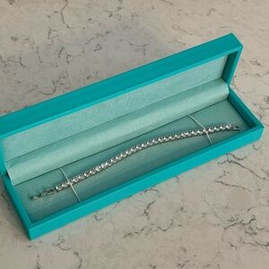 New in box!  7.5 inch length tennis bracelet.